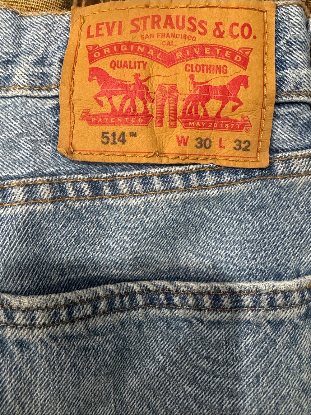 Levi's 514 Slim Straight Jeans in Light Blue Denim with Tan Leather Patch
